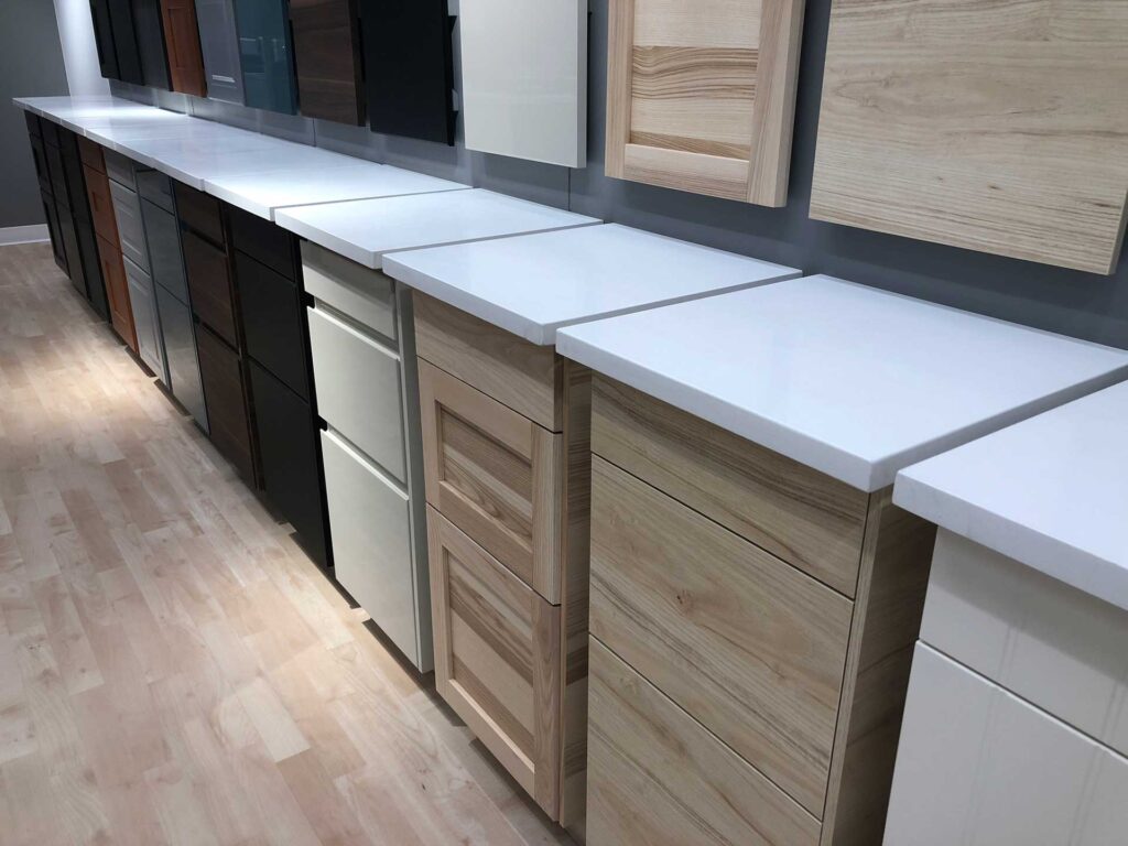 Variety of multi-colored wooden cabinets displayed side by side