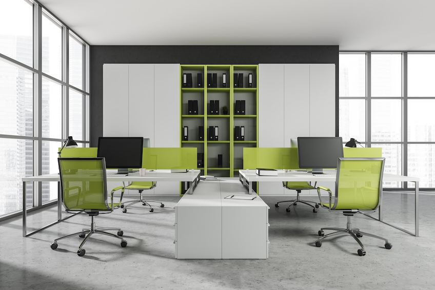 Front view on bright office interior with desk with desktop